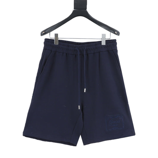 Gucci Hem Plaque Embroidered Shorts front view